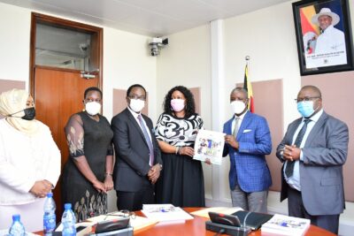 <strong>Thomas Tayebwa (second from right), Deputy Speaker of the Ugandan parliament, receives the 2021 human rights report from UHRC commissioners in Kampala. (Photo courtesy of Uganda Parliament)</strong>